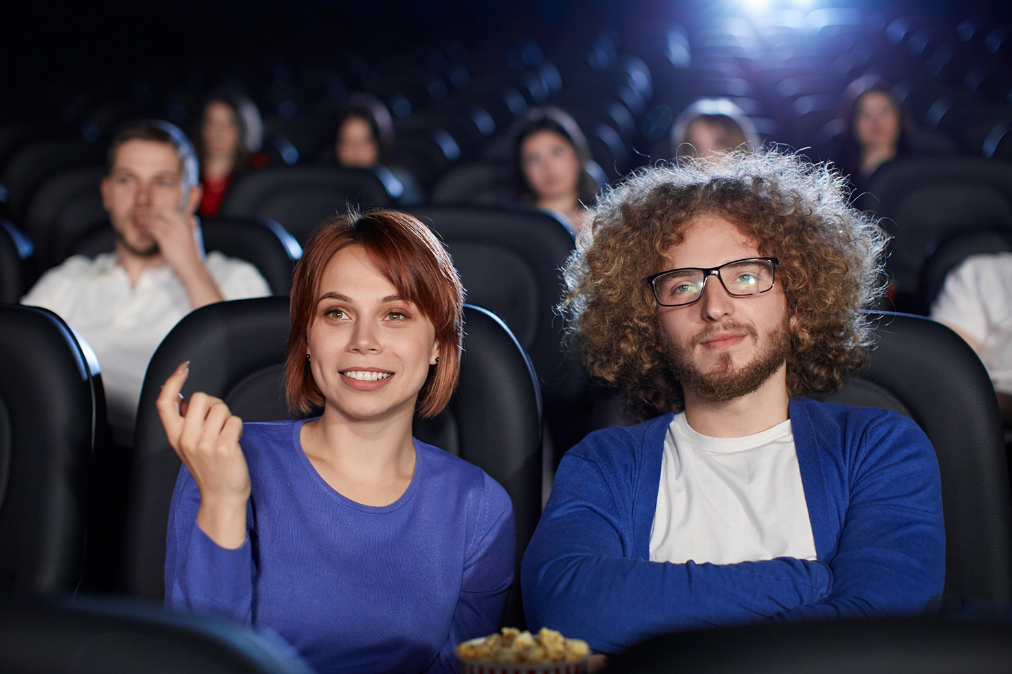 couple-enjoying-date-in-movie-theater-2021-08-30-09-47-00-utc